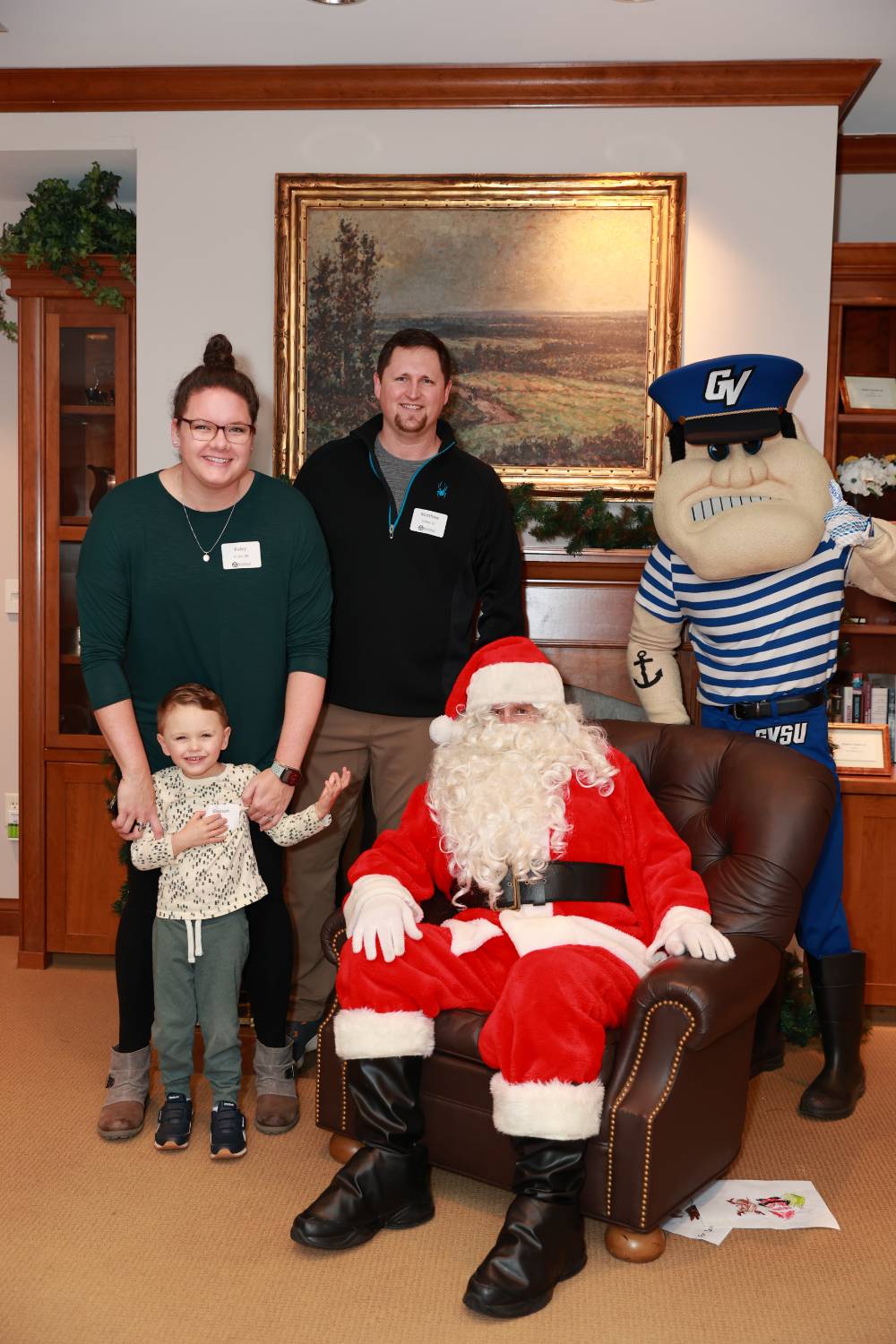 A family of three at the Holiday Brunch with Santa & Louie.